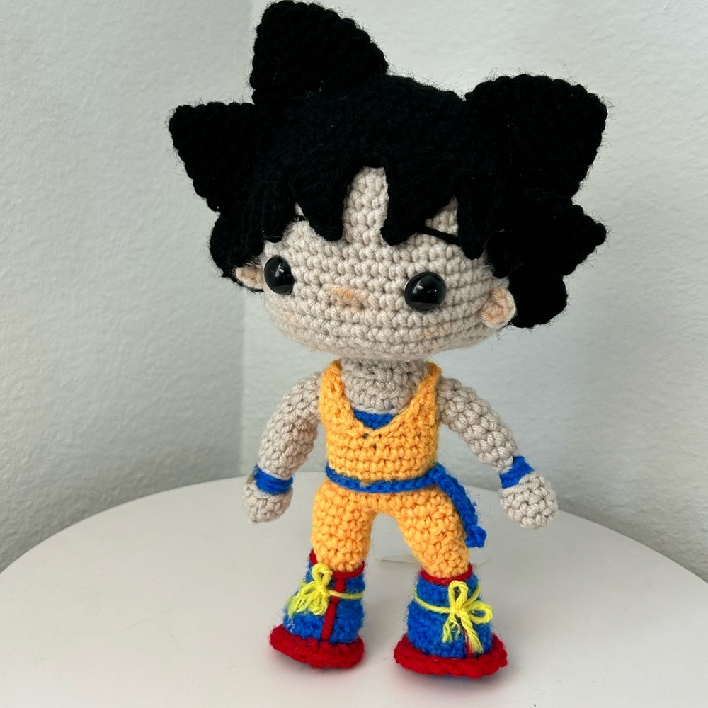 Handmade Crochet Doll with Black Hair and Orange Outfit